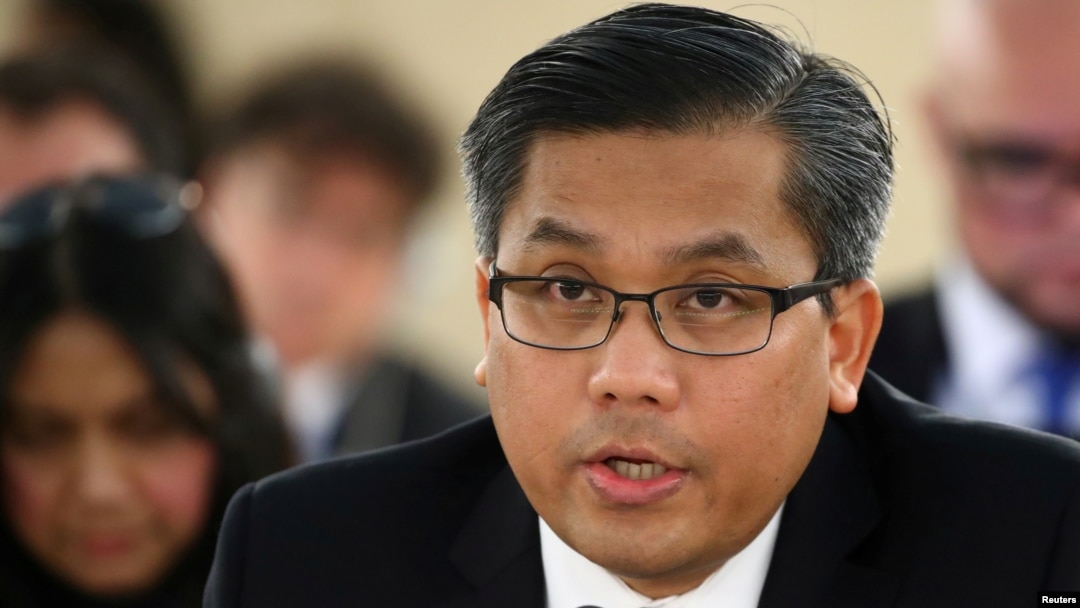 FILE PHOTO: Myanmar's ambassador Kyaw Moe Tun addresses the Human Rights Council at the United Nations in Geneva, Switzerland, March 11, 2019. REUTERS/Denis Balibouse/File Photo
