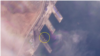 라진항을 촬영한 6일 자 위성사진에 190m 길이의 대형 선박(원 안)이 보인다. 사진=Planet Labs