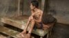 Before he died, this man lived chained to a platform at Kyai Syamsul's center in Brebes, Central Java. While there his ankles swelled, his body became emaciated. © 2012 Andrea Star Reese for Human Rights Watch