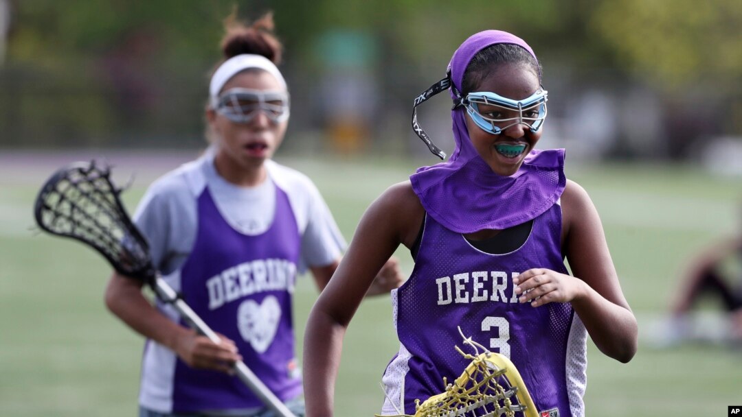 Fadumo Adan, a lacrosse player at Deering High School in Portland, Maine, wears a sports hijab provided by the school during practice in Portland, Maine. Deering High School is providing sport hijabs with the goal of making Muslim girls comfortable and boosting their participation in sports. (AP Photo/Robert F. Bukaty)
