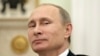 FILE - Russian President Vladimir Putin, shown in 2014, plans to address the U.N. General Assembly on Sept. 28, 2015. His country has ramped up its military presence in Syria. 
