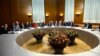 European Union foreign policy chief Catherine Ashton (2nd R) speaks with Iranian Foreign Minister Mohammad Javad Zarif (R) before the start of two days of closed-door nuclear talks at the United Nations European headquarters in Geneva, Switzerland, Nov. 20, 2013.