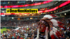 A fan of the Major League Baseball team Cleveland Indians wears a feathered headdress while watching the team's World Series game against the Chicago Cubs in Cleveland, Ohio, October 30, 2016, in what Native Americans regard as offensive cultural appropri