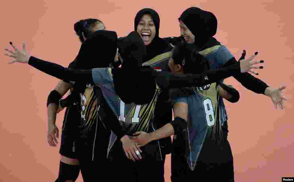 The Indonesia players celebrate a point during the match against Vietnam during the women's volleyball preliminary round at the Southeast Asian Games in Pasig, Philippines.