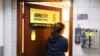 A woman enters the Amnesty International Hong Kong office, after its announcement to close citing China-imposed national security law, in Hong Kong, China on October 25, 2021.