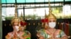 FILE - Thai traditional dancers wearing face masks to help protect themselves from the coronavirus perform at the Erawan Shrine in Bangkok, Thailand, Feb. 7, 2022. 