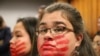 FILE - Joanne Sakar, left, and Natasha Gamache at the arraignment for Brian Steven Smith, who faces 14 charges in the deaths of two Alaska Native women, in Anchorage, Alaska, Oct. 21, 2019.