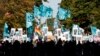 Demonstrators march through Washington toward the U.S. Capitol to rally and demand that the U.S. Congress investigate the National Security Agency's mass surveillance programs, Oct. 26, 2013.