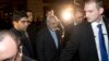 Iranian Foreign Minister Mohammad Javad Zarif (C) arrives at his hotel following his meeting with U.S. Secretary of State John Kerry and European Union foreign policy chief Catherine Ashton, in Geneva, Nov. 8, 2013.