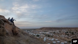 FILE - The Umm Rakouba refugee camp in Qadarif, eastern Sudan, hosts people who fled the Tigray region of Ethiopia, Dec. 14, 2020. UNHCR says, Feb. 23, 2020, at least 7,000 people fled escalating ethnic violence in western Ethiopia to Sudan.