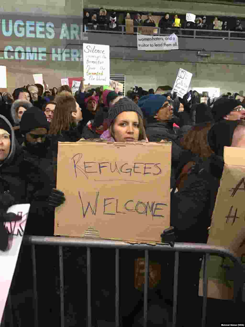 Hundreds of demonstrators gathered at JFK airport to protest President Trump's immigration order