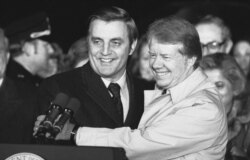 FILE - President Jimmy Carter embraces Vice President Walter Mondale on the South Lawn of the White House in Washington on Jan. 7, 1978.