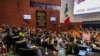 Protesters break into a Senate session in which lawmakers were debating the government's proposed judicial reform, which would make judges stand for election, in Mexico City, Sept. 10, 2024.