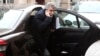 Iran's ambassador to Austria Hassan Tajik leaves his limousine as he arrives at a hotel in Vienna, Feb. 17, 2014.
