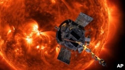 This image made available by NASA shows an artist's rendering of the Parker Solar Probe approaching the Sun. (Steve Gribben/Johns Hopkins APL/NASA via AP)