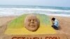 Artist Sudarshan Pattnaik works on a sand sculpture created in the likeness of former South African President Nelson Mandela, in Puri, India, June 9, 2013. 