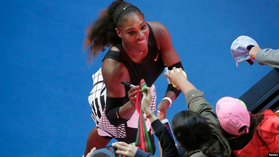 Serena Williams signs autographs after winning her Women's singles semi-final match against Croatia's Mirjana Lucic-Baroni. 