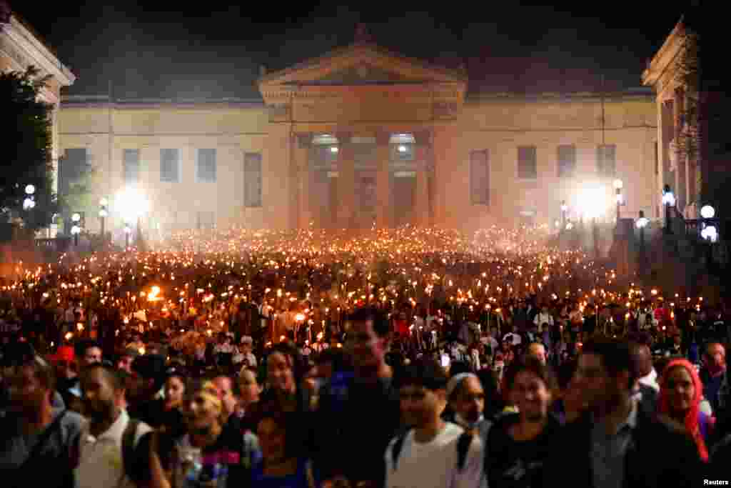 People attend the March of Torches, a yearly celebration of the birthday of Cuba's independence hero Jose Marti, in Havana on January 27, 2025.