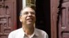 FILE - Moroccan historian and journalist Maati Monjib standing outside the local headquarters of a human rights group in Rabat, Morocco.