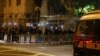 Supporters of pro-democracy activists hold flashlights as a prison van carrying some of the 47 pro-democracy activists charged under the national security law arrives at Lai Chi Kok Reception Centre, in Hong Kong, March 4, 2021. 