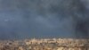TOPSHOT - A Middle East Airlines commercial aircraft taking off from Beirut's international airport, flies amid smoke billowing above the Lebanese capital's southern suburbs, in the aftermath of overnight Israeli airstrikes, on September 28,2024.