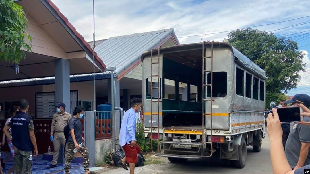 In this photo released by the San Sai District Administrative Office, three journalists working for Democratic Voice of Burma, prepare to get into a van after being arrested at San Sai District in Chiang Mai province north of Thailand May 9, 2021.